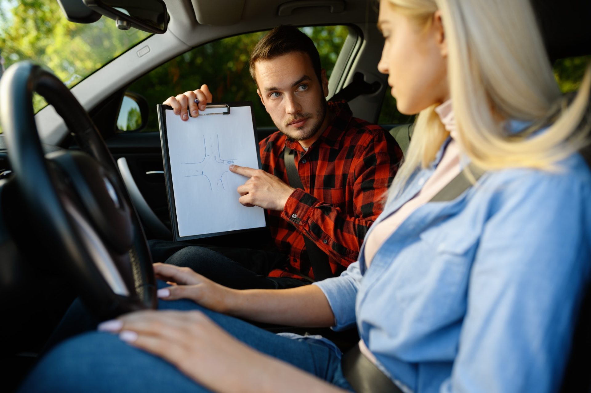 woman-and-man-with-checklist-driving-school-1-e1627375367962.jpg